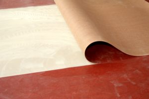 Colocación de rollos de PVC pegados